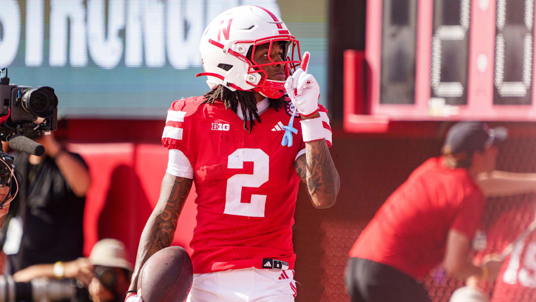 Sep 20, 2025; Lincoln, Nebraska, USA; Nebraska Cornhuskers wide receiver Jacory Barney Jr. (2) reacts after scoring a touchdown against the Michigan Wolverines during the second quarter at Memorial Stadium. Mandatory Credit: Dylan Widger-Imagn Images