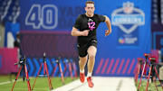 Feb 28, 2025; Indianapolis, IN, USA; Texas tight end Gunnar Helm (TE12) runs in the 40 yard dash during the 2025 NFL Combine at Lucas Oil Stadium. 