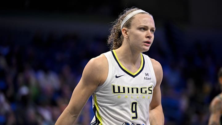 Aug 8, 2025; Arlington, Texas, USA; Dallas Wings guard Grace Berger (9) in action during the game between the Dallas Wings and the New York Liberty at College Park Center. Mandatory Credit: Jerome Miron-Imagn Images