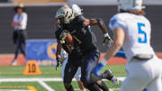 Birmingham Charter running back Dredon Fowles carrying the ball against Acalanes in the CIF State Division 3AA title game on Dec. 9, 2023 at Saddleback College.