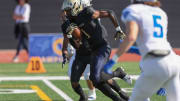 Birmingham Charter running back Dredon Fowles carrying the ball against Acalanes in the CIF State Division 3AA title game on Dec. 9, 2023 at Saddleback College.