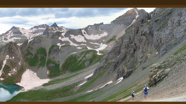 Runners climbing through the mountains