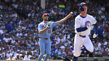 Jun 15, 2024; Chicago, Illinois, USA;  St. Louis Cardinals pitcher Matthew Liberatore (52) throws out Chicago Cubs outfielder Pete Crow-Armstrong (52) after he bunted during the eighth inning at Wrigley Field.