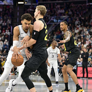 Nov 26, 2024; Salt Lake City, Utah, USA; San Antonio Spurs forward/center Victor Wembanyama (1) collides with Utah Jazz forward/center Lauri Markkanen (23) during the second half at Delta Center. Mandatory Credit: Christopher Creveling-Imagn Images