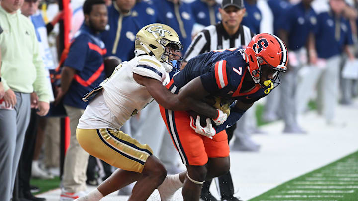 Sep 7, 2024; Syracuse, New York, USA; Syracuse Orange wide receiver Jackson Meeks (7) is pushed out of bounds by Georgia Tech Yellow Jackets defensive back Ahmari Harvey (3) in the third quarter at the JMA Wireless Dome. Mandatory Credit: Mark Konezny-Imagn Images