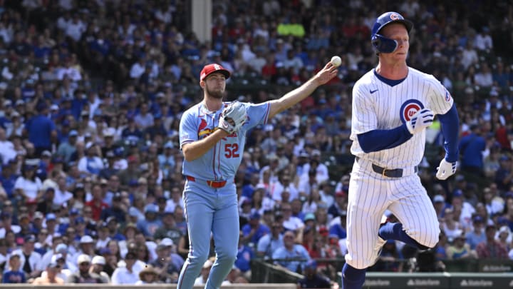 Jun 15, 2024; Chicago, Illinois, USA;  St. Louis Cardinals pitcher Matthew Liberatore (52) throws out Chicago Cubs outfielder Pete Crow-Armstrong (52) after he bunted during the eighth inning at Wrigley Field.