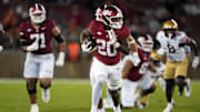 Sep 13, 2025; Stanford, California, USA; Stanford Cardinal running back Micah Ford (20) carries the ball against the Boston College Eagles during the fourth quarter at Stanford Stadium. Mandatory Credit: Darren Yamashita-Imagn Images