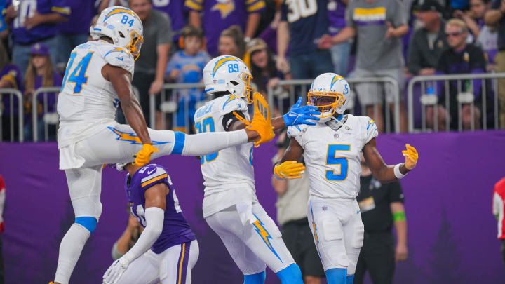 Sep 24, 2023; Minneapolis, Minnesota, USA; Los Angeles Chargers wide receiver Joshua Palmer (5) celebrates his touchdown with tight end Stone Smartt (84) and tight end Donald Parham Jr. (89) against the Minnesota Vikings in the fourth quarter at U.S. Bank Stadium. Mandatory Credit: Brad Rempel-USA TODAY Sports