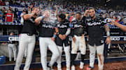 Aug 1, 2025; Miami, Florida, USA;  Miami Marlins center fielder Jakob Marsee (87), left fielder Kyle Stowers (28), third baseman Javier Sanoja (46), second baseman Xavier Edwards (9) and catcher Agustin Ramirez (50) celebrate after winning the game against the New York Yankees at loanDepot Park. Mandatory Credit: Sam Navarro-Imagn Images