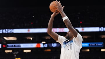 Mar 2, 2025; Phoenix, Arizona, USA; Minnesota Timberwolves center Naz Reid (11) shoots against the Phoenix Suns during the first half at Footprint Center. Mandatory Credit: Joe Camporeale-Imagn Images