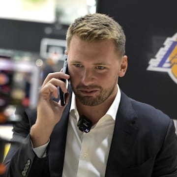 Aug 2, 2025; El Segundo, CA, USA; Los Angeles Lakers Luka Doncic (77) is interviewed by ESPN LA radio following a press conference announcing the signing of a 3-year, $165 million contract extension at UCLA Health Training Center. Mandatory Credit: Jayne Kamin-Oncea-Imagn Images