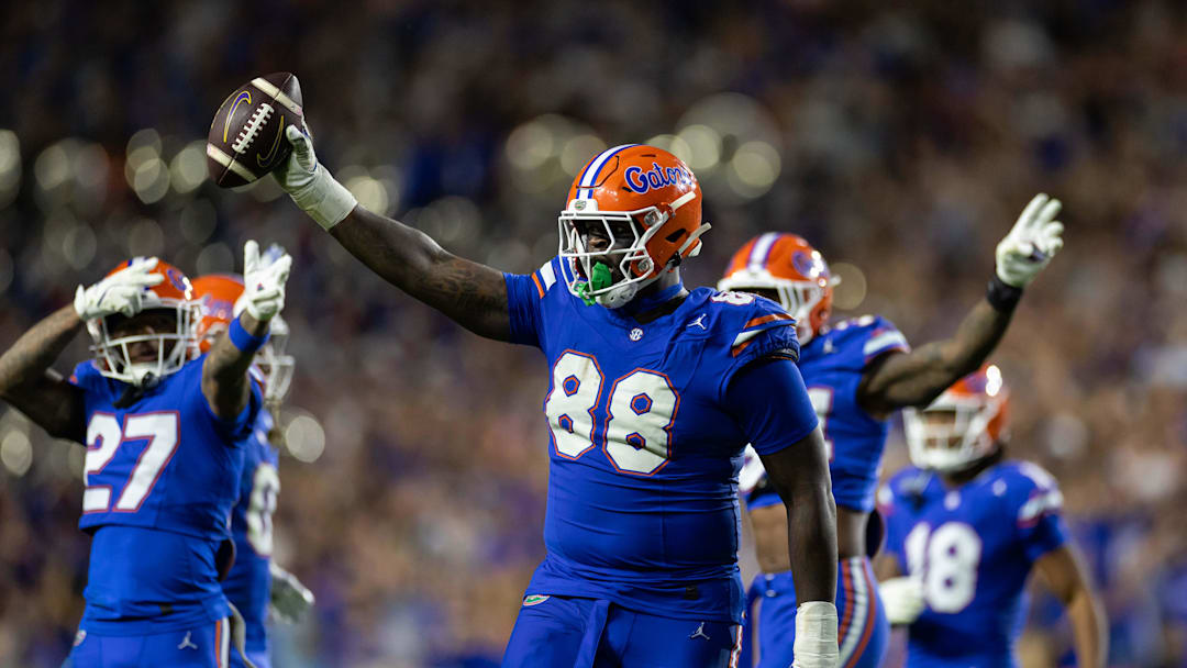 Nov 16, 2024; Gainesville, Florida, USA; Florida Gators defensive lineman Caleb Banks (88) celebrates with the ball after a fumble recovery against the LSU Tigers during the second half at Ben Hill Griffin Stadium. Mandatory Credit: Matt Pendleton-Imagn Images Nov 16, 2024; Gainesville, Florida, USA; Florida Gators defensive lineman Caleb Banks (88) celebrates with the ball after a fumble recovery against the LSU Tigers during the second half at Ben Hill Griffin Stadium. Mandatory Credit: Matt Pendleton-Imagn Images