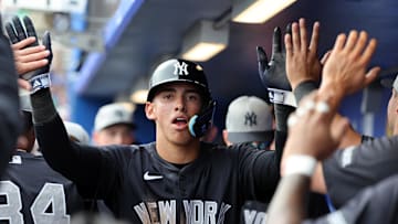 Feb 22, 2025; Dunedin, Florida, USA;  New York Yankees shortstop George Lombard Jr. (96)  is congratulated after he scored a run during the sixth inning against the Toronto Blue Jays at TD Ballpark. Mandatory Credit: Kim Klement Neitzel-Imagn Images