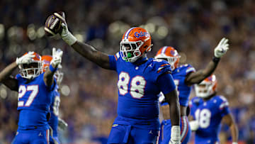Nov 16, 2024; Gainesville, Florida, USA; Florida Gators defensive lineman Caleb Banks (88) celebrates with the ball after a fumble recovery against the LSU Tigers during the second half at Ben Hill Griffin Stadium. Mandatory Credit: Matt Pendleton-Imagn Images