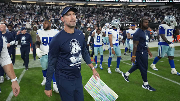 Cowboys coach Brian Schottenheimer and the rest of the team's coaching staff wore shirts with Kneeland's face on them during Monday night's win over the Raiders.