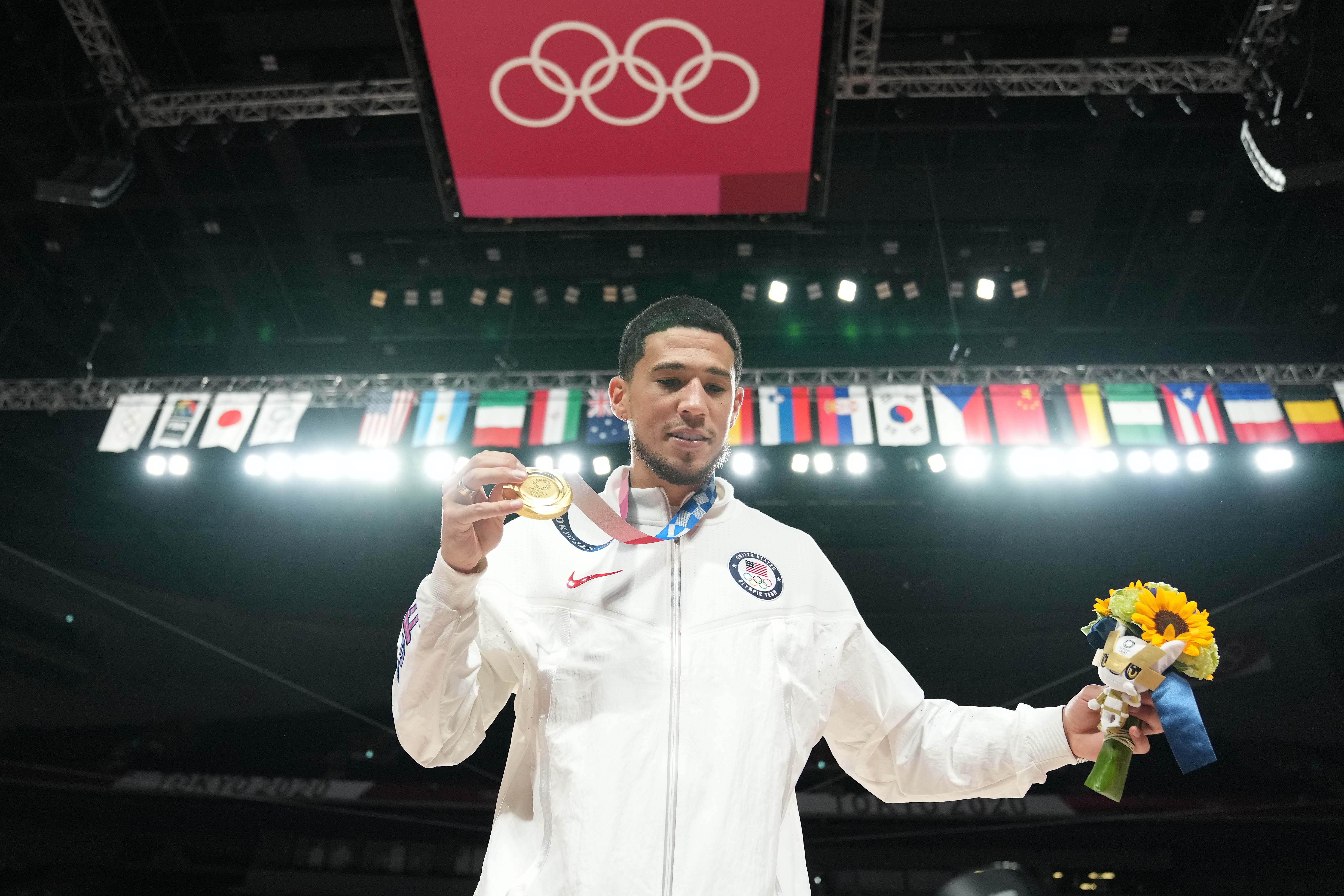 Team USA guard Devin Booker celebrates after winning the gold medal.