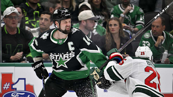 Apr 20, 2026; Dallas, Texas, USA; Minnesota Wild defenseman Jonas Brodin (25) grabs Dallas Stars left wing Jamie Benn (14) during the second period in game two of the first round of the 2026 Stanley Cup Playoffs at American Airlines Center. Mandatory Credit: Jerome Miron-Imagn Images