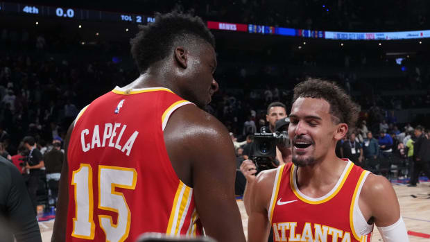 Nov 9, 2023; Mexico City, MEX; Atlanta Hawks guard Trae Young (11) and center Clint Capela (15) react after the 2023 NBA Mexico City Game against the Orlando Magic at the Arena CDMX. Mandatory Credit: Kirby Lee-USA TODAY Sports