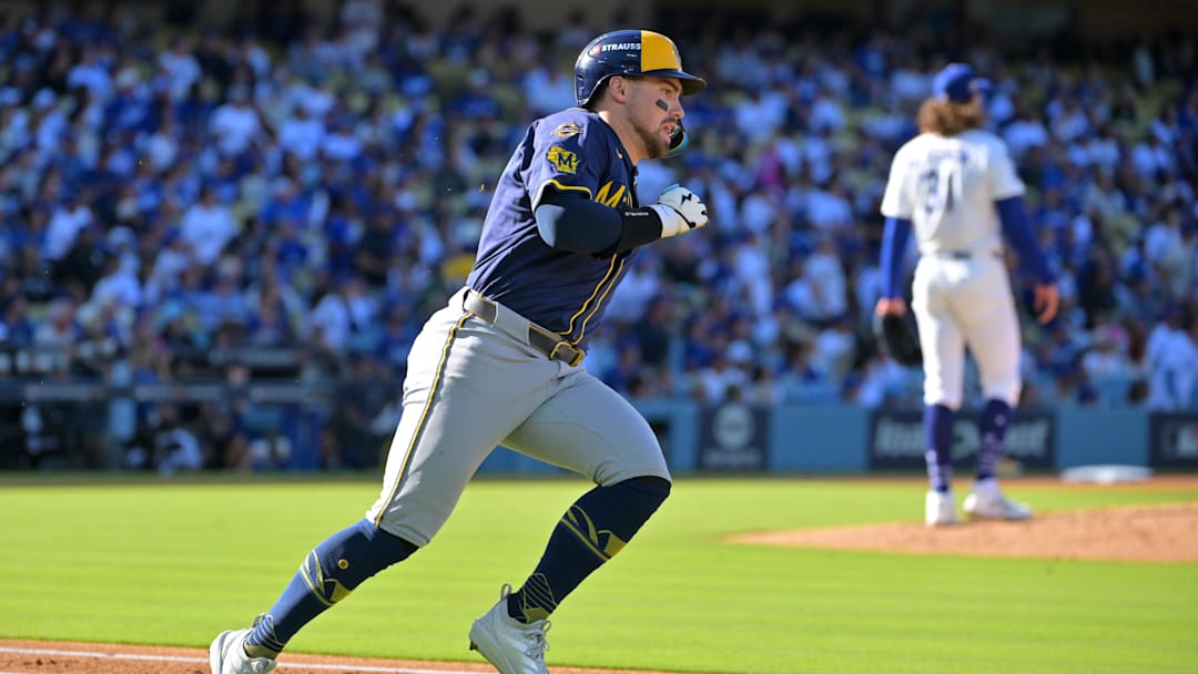 Oct 16, 2025; Los Angeles, California, USA; Milwaukee Brewers third baseman Caleb Durbin (21) runs after hitting a triple against the Los Angeles Dodgers in the second inning during game three of the NLCS round for the 2025 MLB playoffs at Dodger Stadium. Mandatory Credit: Jayne Kamin-Oncea-Imagn Images