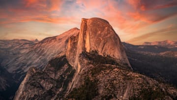 From Yosemite National Park’s Glacier Point, hikers can witness Half Dome bathed in alpenglow.
