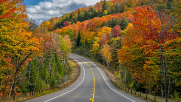 This scene near Saranac Lake in the Adirondacks shows why New York is the top state for fall road trips.