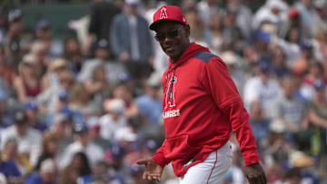  Los Angeles Angels manager Ron Washington walks off the mound against the Los Angeles Dodgers in the third inning at Tempe Diablo Stadium. 