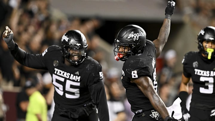 Oct 26, 2024; College Station, Texas, USA; Texas A&M Aggies running back Le'Veon Moss (8) reacts after scoring a touchdown against the LSU Tigers in the fourth quarter at Kyle Field. Mandatory Credit: Maria Lysaker-Imagn Images. 