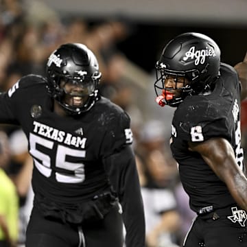 Texas A&M Aggies running back Le'Veon Moss and OL Armaj Reed-Adams react after scoring a touchdown against the LSU Tigers