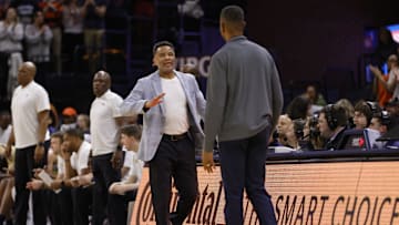 Feb 8, 2025; Charlottesville, Virginia, USA; Georgia Tech Yellow Jackets head coach Damon Stoudamire (center) greets Virginia Cavaliers head coach Ron Sanchez (right) after their game at John Paul Jones Arena. Mandatory Credit: Amber Searls-Imagn Images
