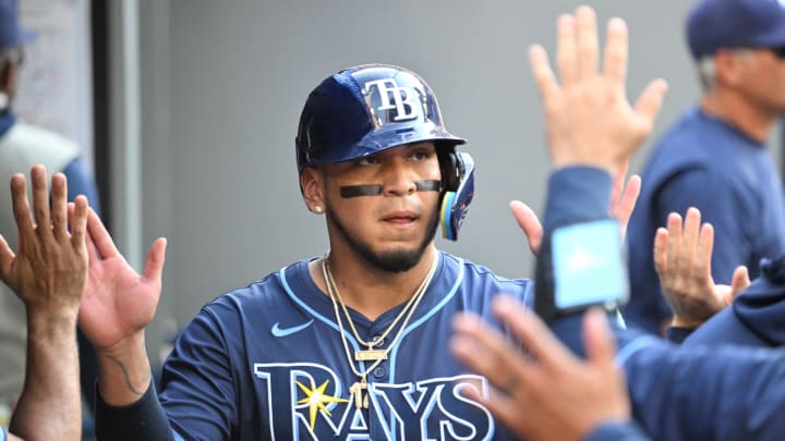 Jul 25, 2024; Toronto, Ontario, CAN; Tampa Bay Rays first baseman Isaac Paredes (17) celebrates in the dugout with teammates after scoring a run against the Toronto Blue Jays in the seventh inning at Rogers Centre. Mandatory Credit: Dan Hamilton-USA TODAY Sports