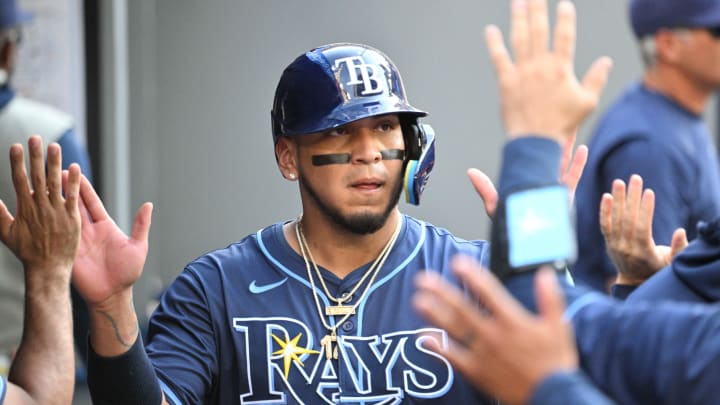 Jul 25, 2024; Toronto, Ontario, CAN; Tampa Bay Rays first baseman Isaac Paredes (17) celebrates in the dugout with teammates after scoring a run against the Toronto Blue Jays in the seventh inning at Rogers Centre. Mandatory Credit: Dan Hamilton-USA TODAY Sports