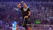 Stone Cold Steve Austin celebrates with beer during WrestleMania at AT&T Stadium. 