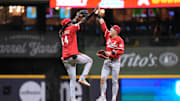 Sep 26, 2025; Milwaukee, Wisconsin, USA;  Cincinnati Reds shortstop Elly De La Cruz (44) greets center fielder TJ Friedl (29) following the game against the Milwaukee Brewers at American Family Field. Mandatory Credit: Jeff Hanisch-Imagn Images