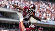 Oct 5, 2024; College Station, Texas, USA; Texas A&M Aggies running back Le'Veon Moss (8) celebrates with offensive lineman Chase Bisontis (71) after scoring a touchdown in the second quarter against the Missouri Tigers at Kyle Field.