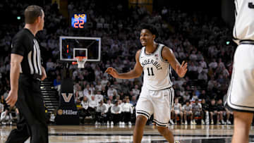 Mar 1, 2025; Nashville, Tennessee, USA;  Vanderbilt Commodores guard AJ Hoggard (11) reacts to the referee on the called foul against the Vanderbilt Commodores during the second half at Memorial Gymnasium. Mandatory Credit: Steve Roberts-Imagn Images