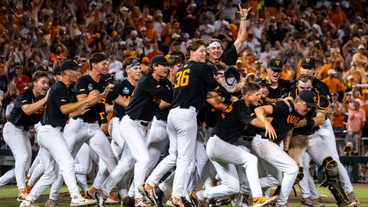 The Tennessee Volunteers dogpile after defeating the Texas A&M Aggies at Charles Schwab Field Omaha.