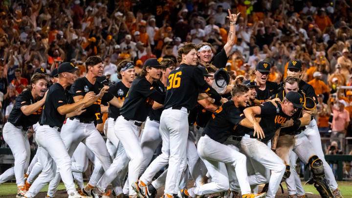 Jun 24, 2024; Omaha, NE, USA; The Tennessee Volunteers dogpile after defeating the Texas A&M Aggies at Charles Schwab Field Omaha. Mandatory Credit: Dylan Widger-USA TODAY Sports