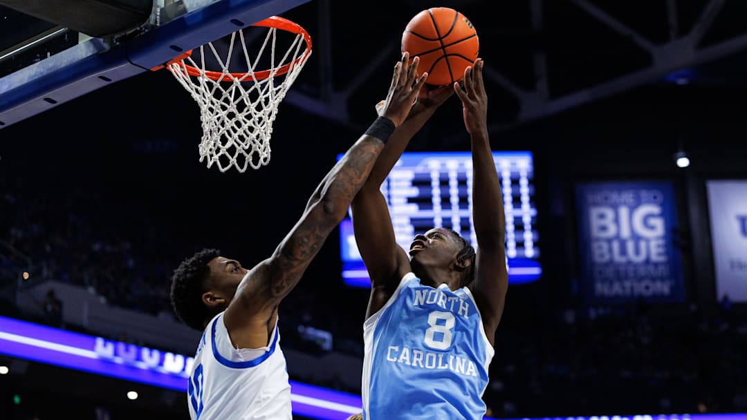Dec 2, 2025; Lexington, Kentucky, USA; North Carolina Tar Heels forward Caleb Wilson (8) goes to the basket against Kentucky Wildcats forward Brandon Garrison (10) during the first half at Rupp Arena at Central Bank Center.