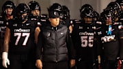 Cincinnati Bearcats head coach Scott Satterfield prepares to take the field with the Cincinnati Bearcats before the NCAA football game between the Cincinnati Bearcats and BYU Cougars at Nippert Stadium in Cincinnati on Nov. 22, 2025.
