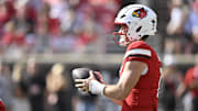 Oct 4, 2025; Louisville, Kentucky, USA; Louisville Cardinals quarterback Miller Moss (7) looks to pass during the first quarter against the Virginia Cavaliers at L&N Federal Credit Union Stadium. Mandatory Credit: Jamie Rhodes-Imagn Images
