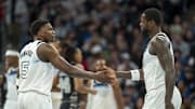 Mar 9, 2025; Minneapolis, Minnesota, USA; Minnesota Timberwolves guard Anthony Edwards (5) shakes hands with forward Julius Randle (30) after making a shot against the San Antonio Spurs in the first half at Target Center. Mandatory Credit: Jesse Johnson-Imagn Images