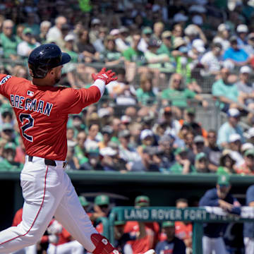 Mar 17, 2025; Fort Myers, Florida, USA; Boston Red Sox Alex Bregman (2) connects with the ball in the first inning against the Baltimore Orioles at JetBlue Park at Fenway South.