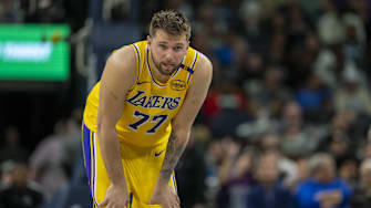 Apr 25, 2025; Minneapolis, Minnesota, USA; Los Angeles Lakers guard Luka Doncic (77) looks on against the Minnesota Timberwolves in the first half during game three of first round for the 2024 NBA Playoffs at Target Center. Mandatory Credit: Jesse Johnson-Imagn Images