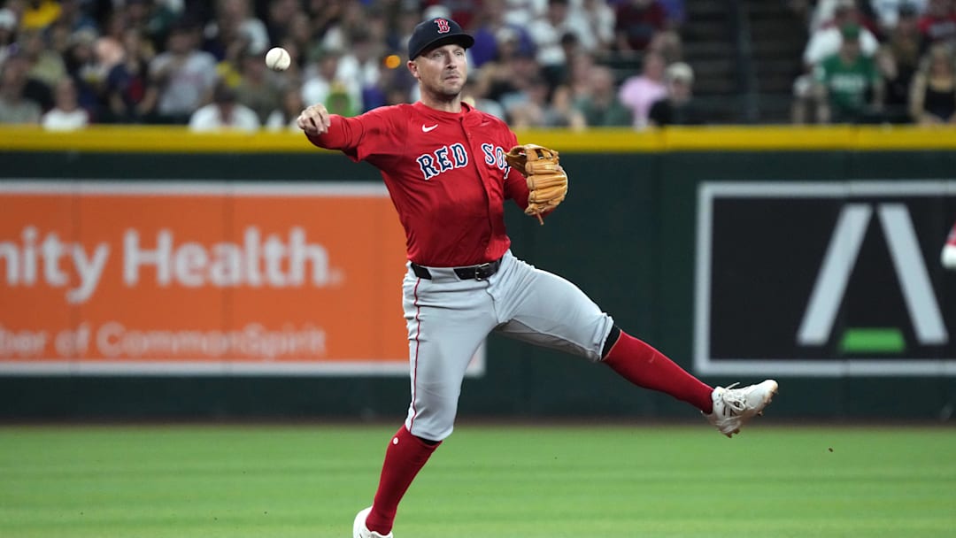 Sep 5, 2025; Phoenix, Arizona, USA; Boston Red Sox third base Alex Bregman (2) mkaes the off balance throw for an out against the Arizona Diamondbacks in the first inning at Chase Field. Mandatory Credit: Rick Scuteri-Imagn Images