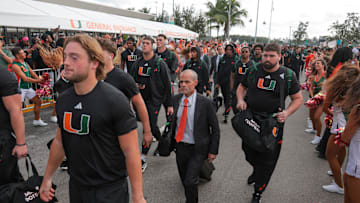 Oct 17, 2025; Miami Gardens, Florida, USA; Miami Hurricanes offensive line coach Alex Mirabal during the Hurricanes Walk before the game against the Louisville Cardinals at Hard Rock Stadium. Mandatory Credit: Sam Navarro-Imagn Images