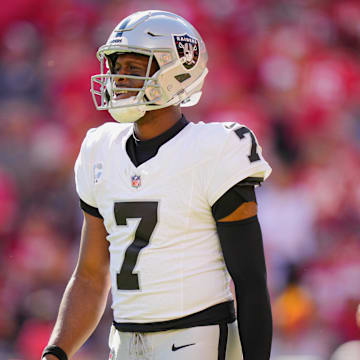 Oct 19, 2025; Kansas City, Missouri, USA; Las Vegas Raiders quarterback Geno Smith (7) reacts during the fourth quarter of the game against the Kansas City Chiefs at GEHA Field at Arrowhead Stadium. Mandatory Credit: Jay Biggerstaff-Imagn Images