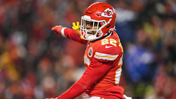 Jan 21, 2023; Kansas City, Missouri, USA; Kansas City Chiefs safety Juan Thornhill (22) celebrates during the second half of an AFC divisional round game against the Jacksonville Jaguars at GEHA Field at Arrowhead Stadium. Mandatory Credit: Jay Biggerstaff-Imagn Images