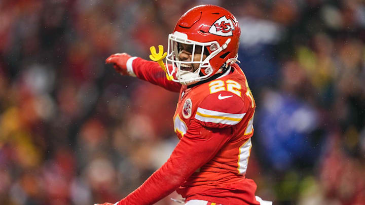 Jan 21, 2023; Kansas City, Missouri, USA; Kansas City Chiefs safety Juan Thornhill (22) celebrates during the second half of an AFC divisional round game against the Jacksonville Jaguars at GEHA Field at Arrowhead Stadium. Mandatory Credit: Jay Biggerstaff-Imagn Images