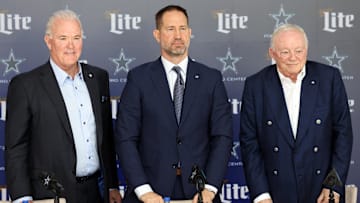 Dallas Cowboys CEO Stephen Jones, head coach Brian Schottenheimer and owner Jerry Jones pose for pictures after a press conference at the Star.  