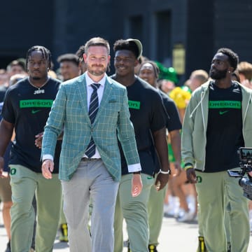 Aug 31, 2024; Eugene, Oregon, USA; Oregon Ducks head coach Dan Lanning leads the team into the stadium before the game against the Idaho Vandals at Autzen Stadium.